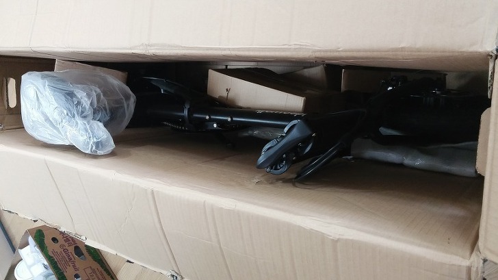 Large shipping box containing the Ideawalk folding electric bike before unboxing