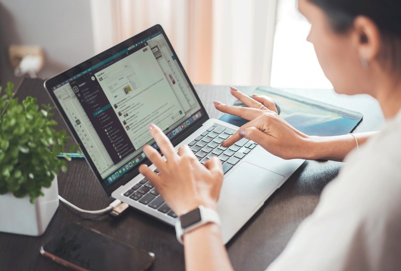 a man using an online tool on his laptop