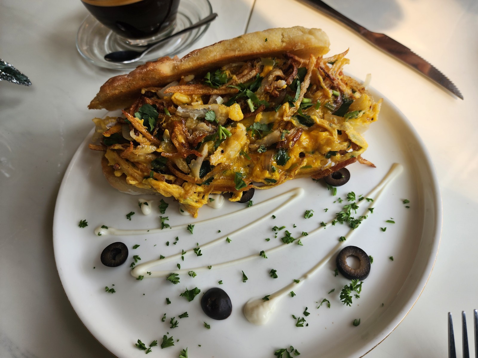 fried codfish with egg. potato and onionwith bread