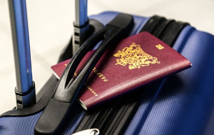 Passport&amp;#44; Luggage&amp;#44; Trolley&amp;#44; Passport stuck in the handle of a suitcase