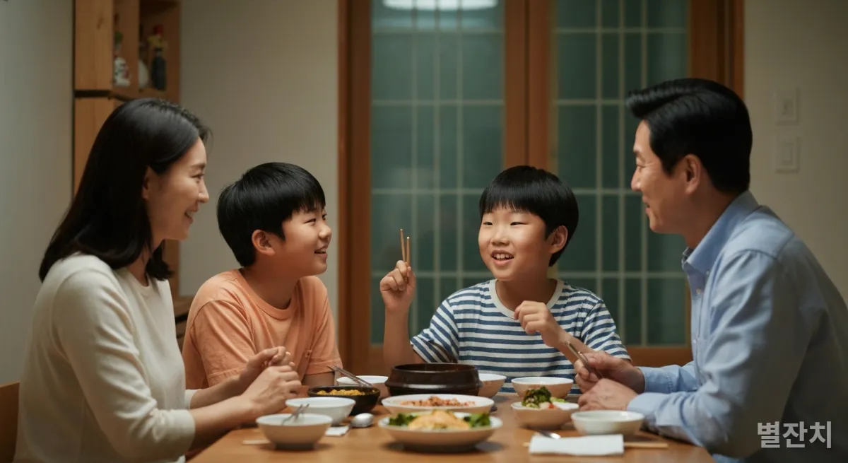 한국 가족이 식탁에 앉아 아이의 이야기를 경청하는 모습