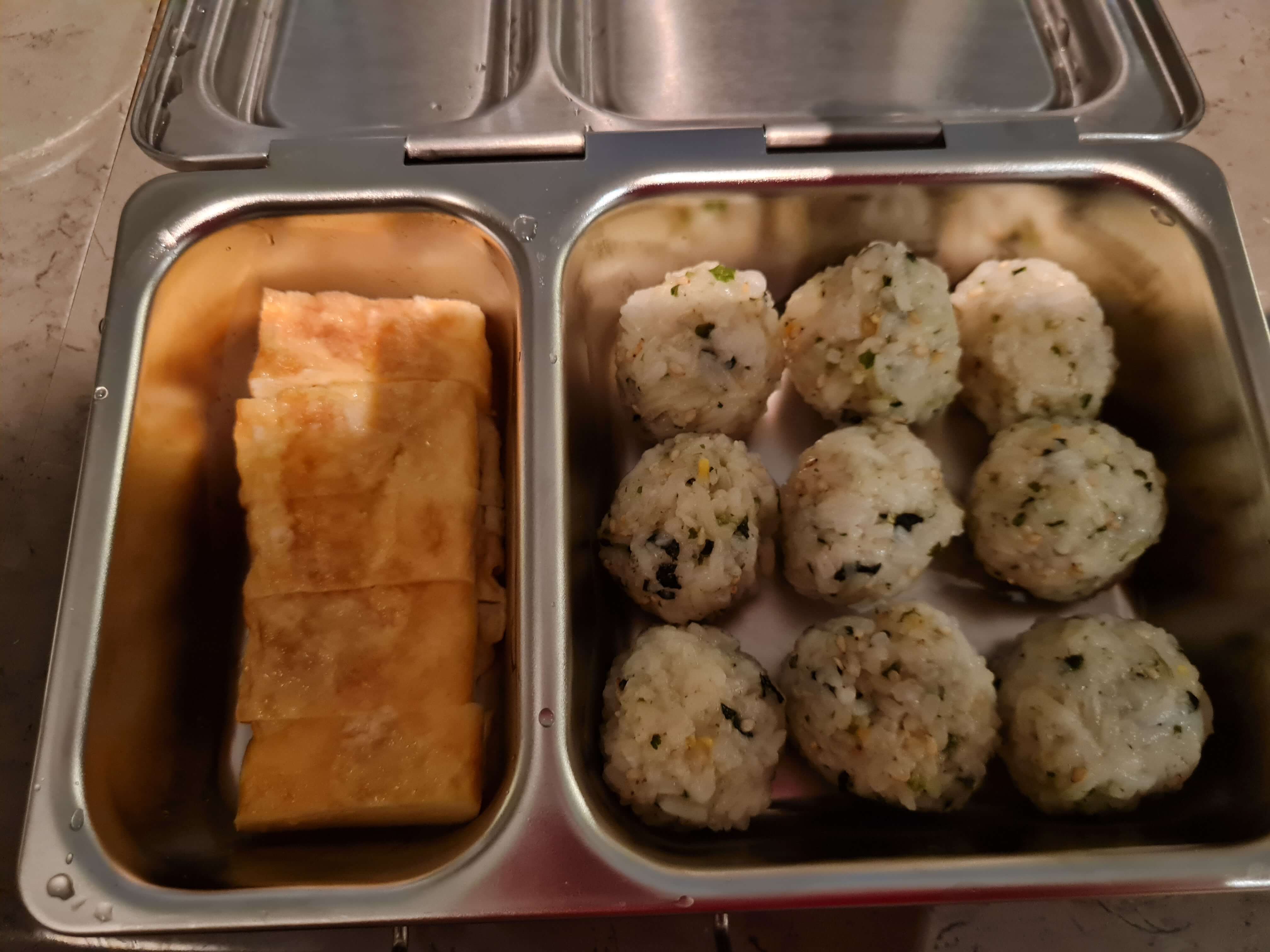 first day lunch box - rice balls, egg rolls