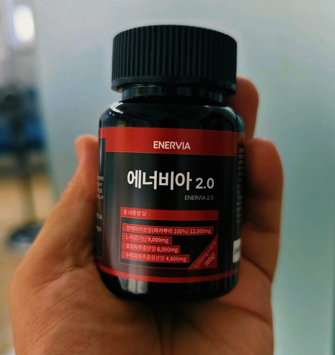 enervia tablet size comparison on palm hand Korean man