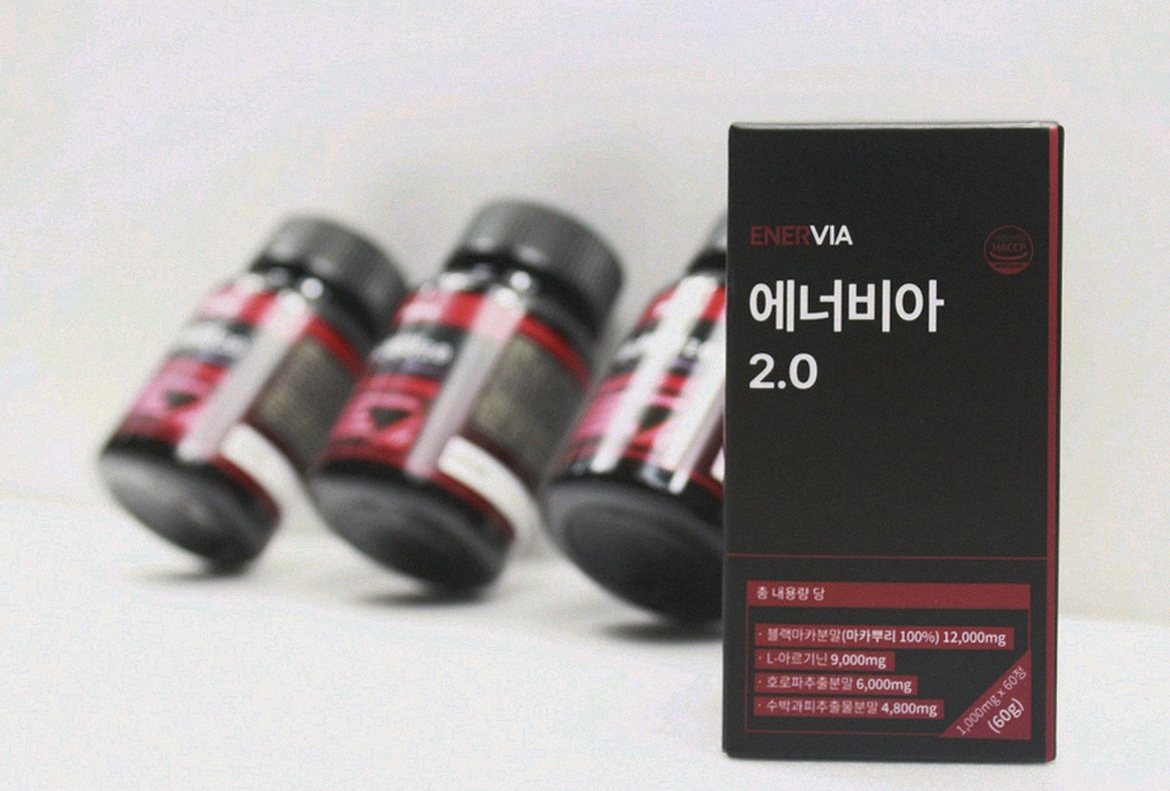Korean Asian man in late 40s morning supplement routine kitchen