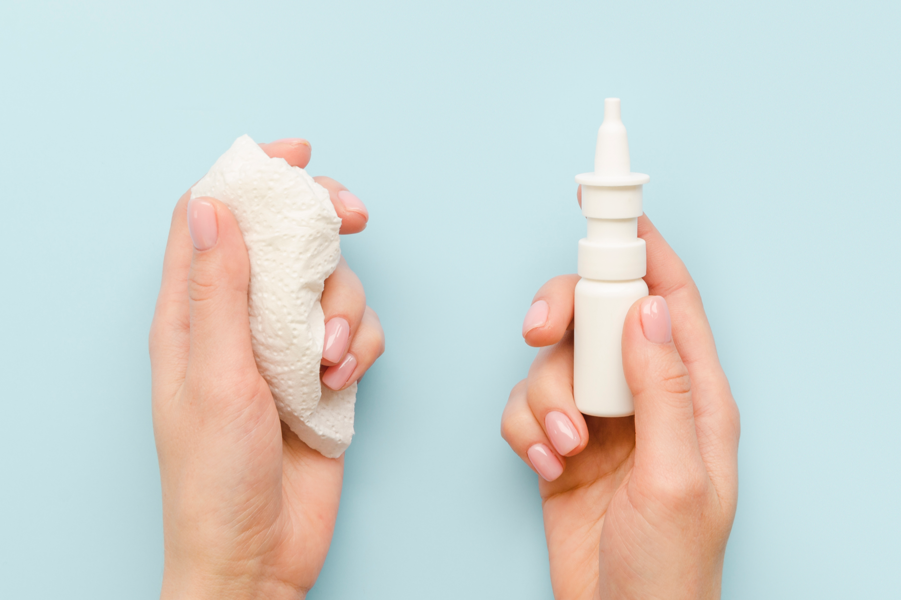&copy; Close-up hands holding nasal spray, Freepik