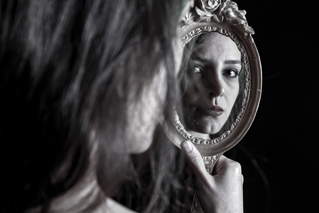 woman-looking-into-a-mirror