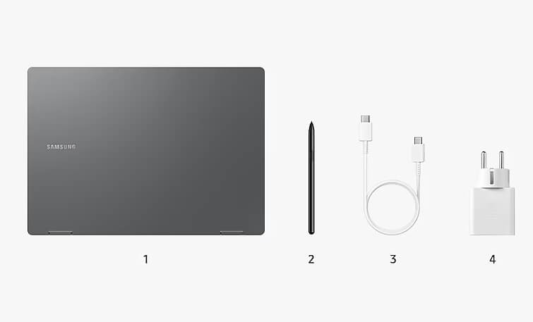 회색 노트북과 케이블, 어뎁터가 나란히 놓여있음