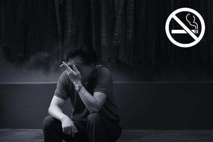 흡연하는-남성과-금연표시
