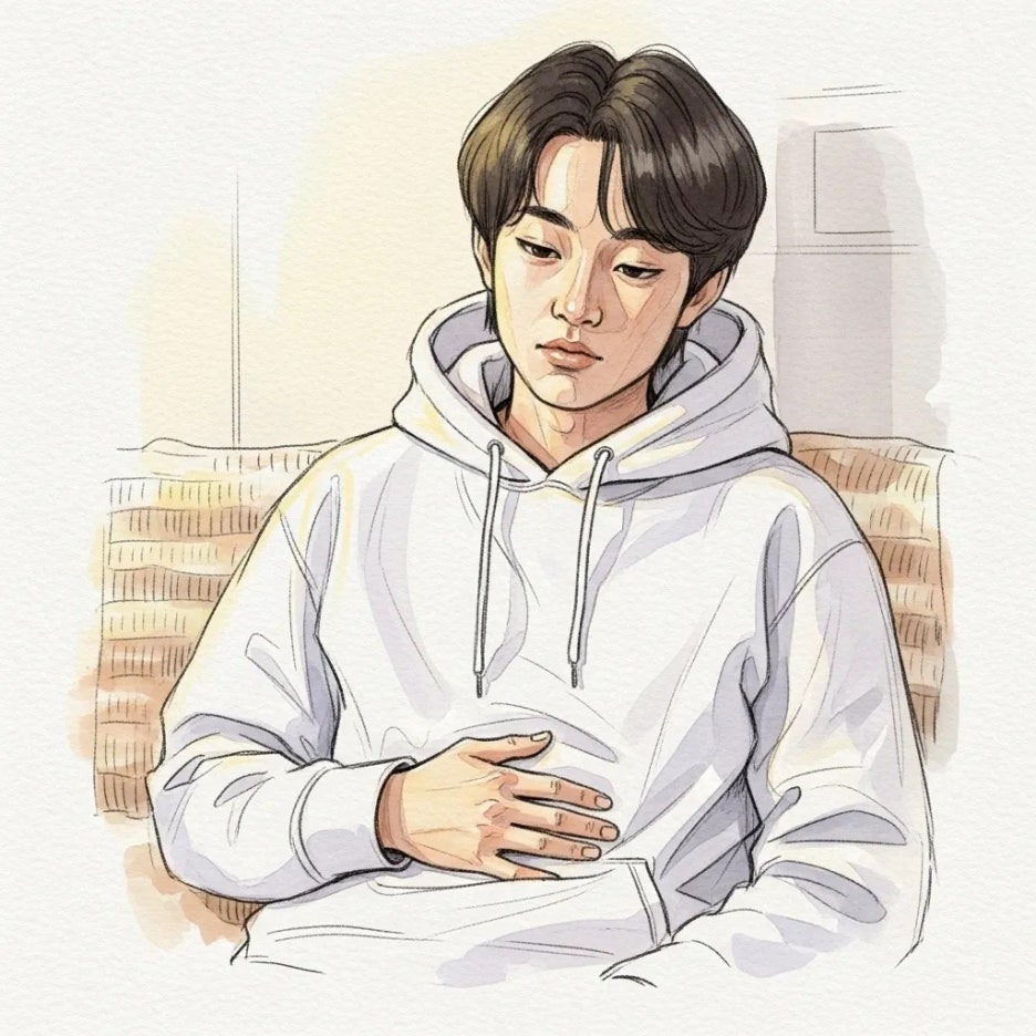 배가 조금 불편해 보이는 사람의 모습.