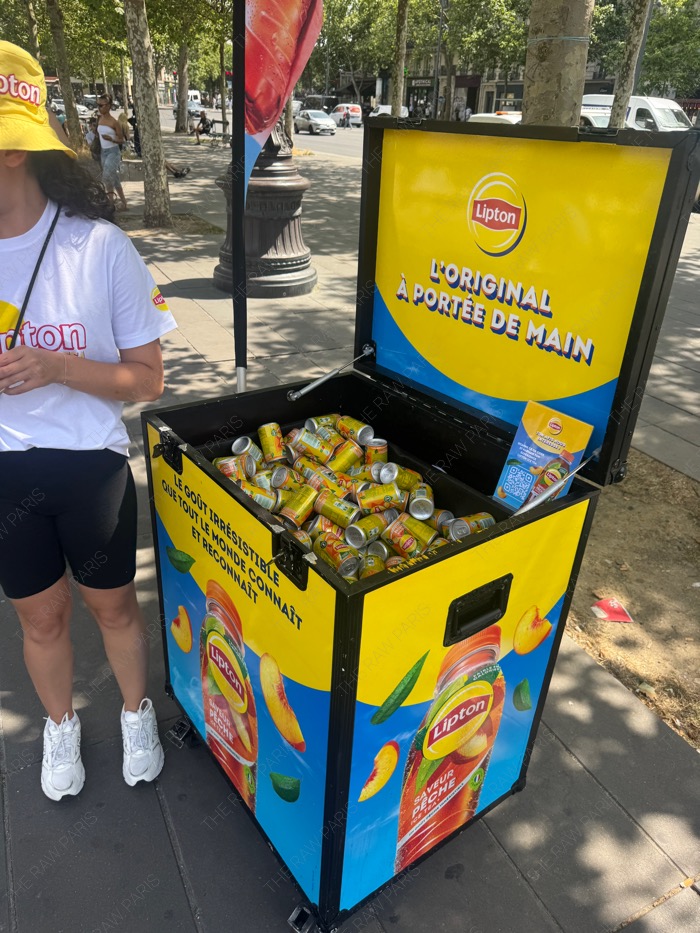 Lipton ice tea street promotion stall offering cold drinks to people in Paris during summer