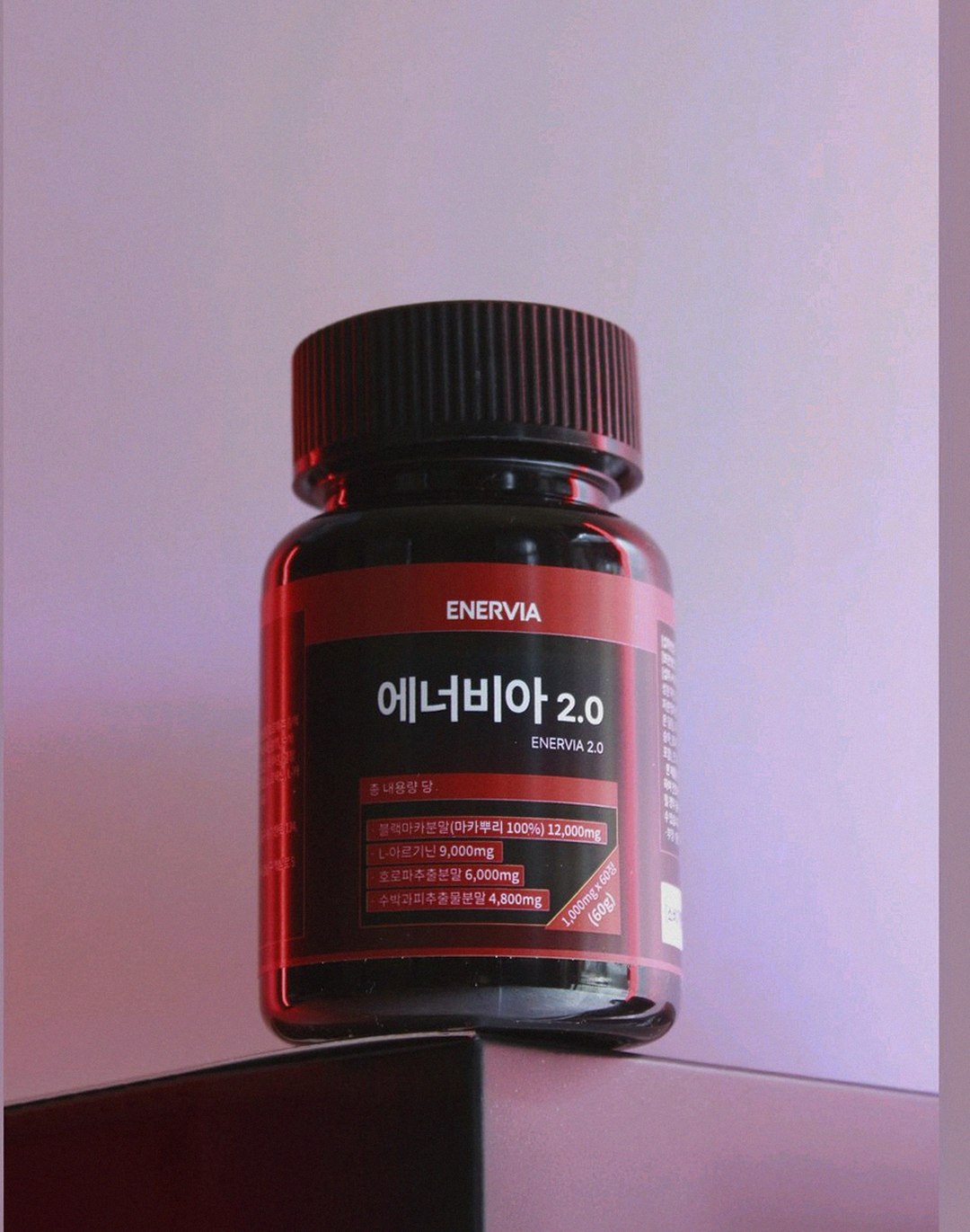 enervia 2.0 bottle on desk next to laptop
