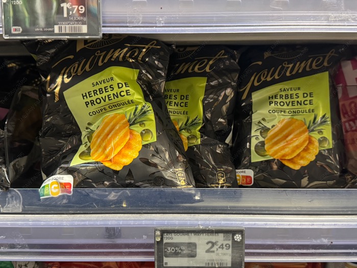 Lays Gourmet Saveur Herbes de Provence wavy potato chips packet on Monoprix shelf