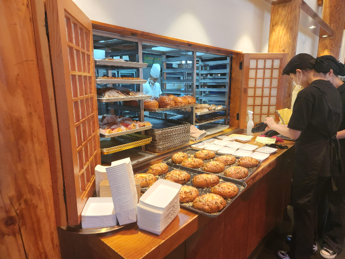 Freshly baked breads are served on a plate.