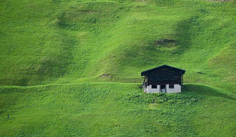 a small house in a meadow