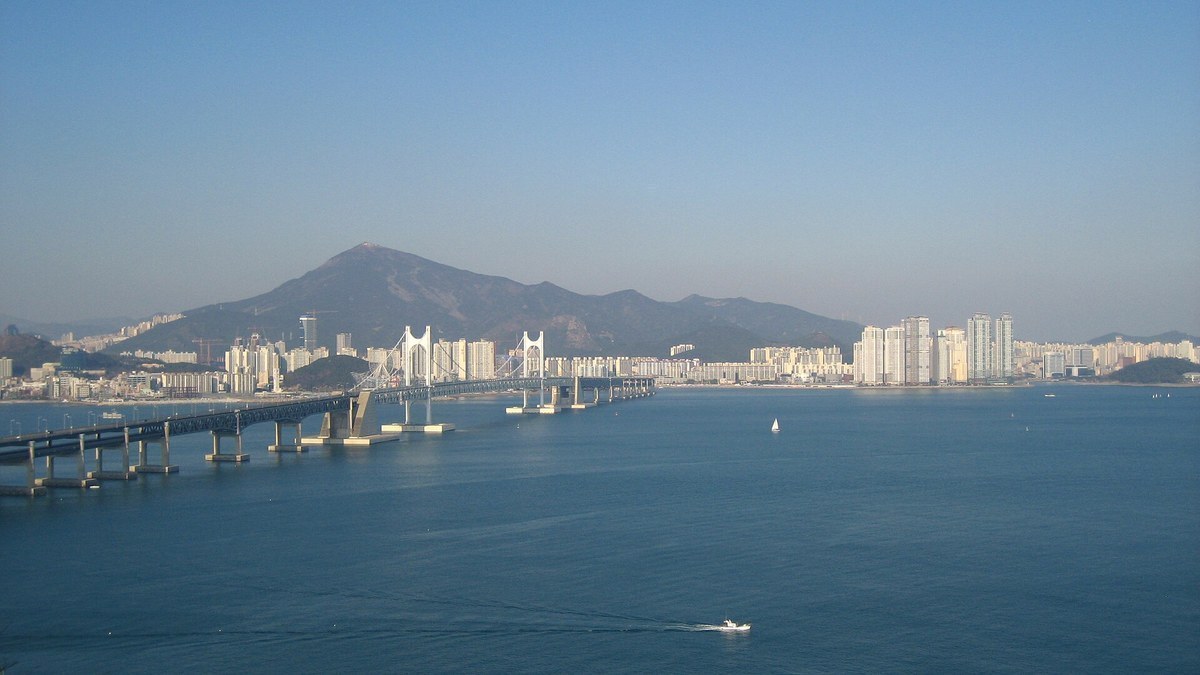 View from Igidae Park across the water to Gwangan Bridge and the Busan skyline on a clear day