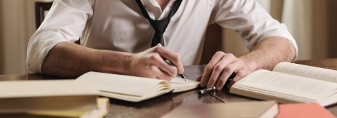 A young person is in the middle of writing.
