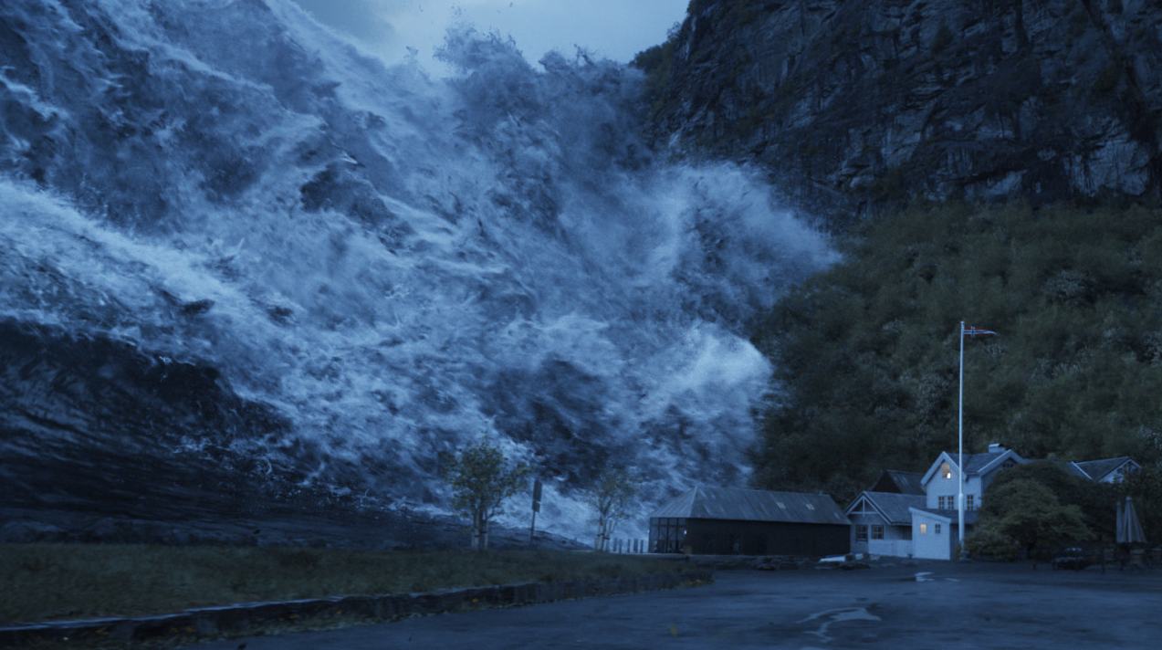 더 웨이브 영화 중 대규모 산사태로 발행한 쓰나미가 마을의 집을 덮치는 모습.