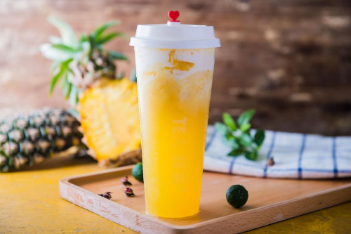 Tropical pineapple mango energy juice served cold in a glass