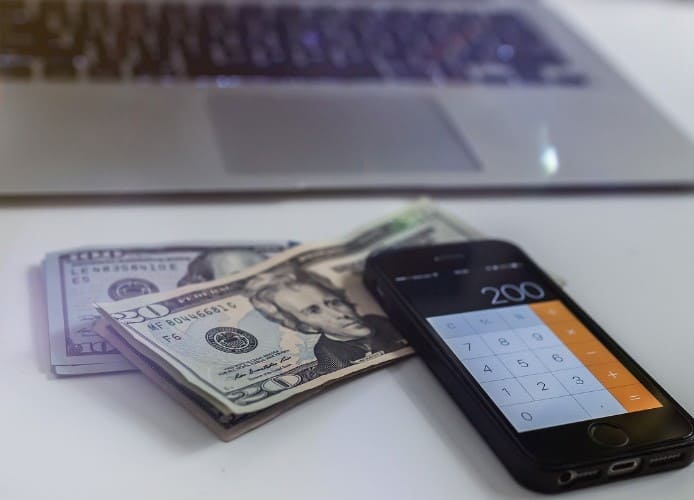 Money, Banknotes, cell phone calculator, laptop