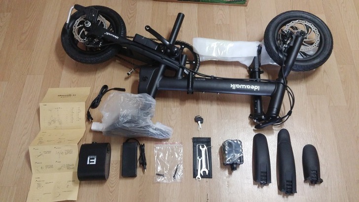 Complete set of Ideawalk electric bike components laid out for unboxing