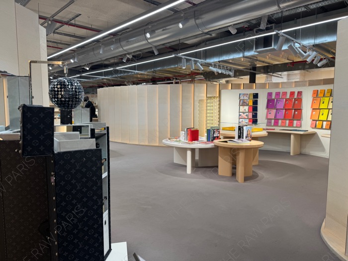 Exclusive gift shop section inside LV DREAM Paris featuring limited edition Louis Vuitton books, trunks, and curated lifestyle goods ❘ La section boutique de souvenirs exclusive &agrave; l'int&eacute;rieur de LV DREAM Paris avec des livres et des malles Louis Vuitton⁠
