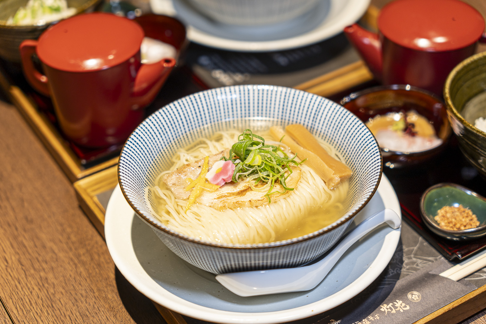 Sea-bream Salt Soba Doka — Namba Dining Maison: A noodle dish topped with green onions and assorted toppings.