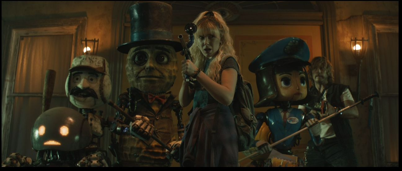 주인공 미셀을 중심으로 로봇들이 무기를 들고 다른 적과 싸우기 위해 전투태세를 취하고 있는 사진