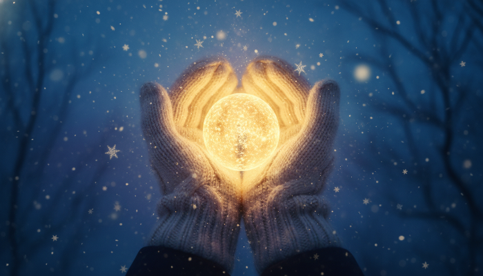 겨울 밤하늘 아래 장갑 낀 손으로 작은 빛을 소중히 감싸 쥔 모습, 희망과 내면의 힘을 상징