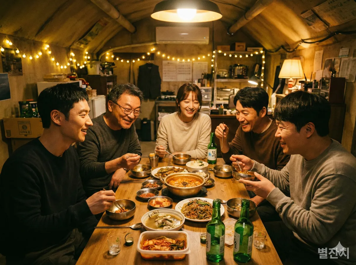 지하 아지트에서 함께 식사하며 팀워크를 다지는 무지개 운수 팀원들의 따뜻한 모습