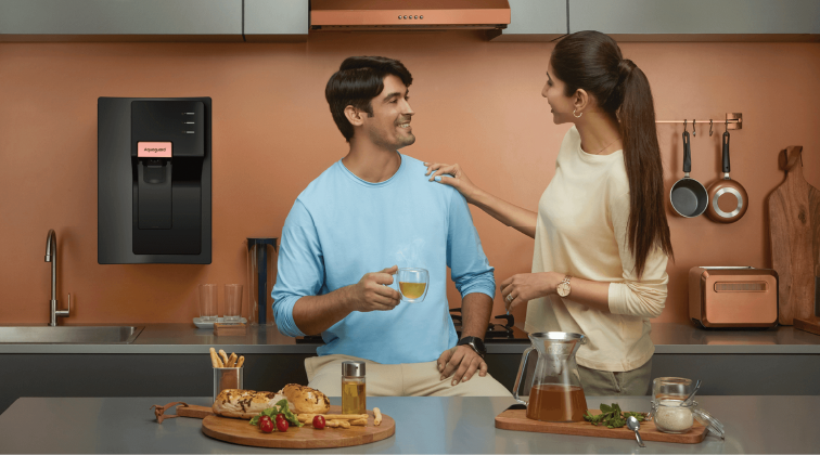 Used water purifier in a modern kitchen setting, illustrating a well-maintained second-hand appliance for eco-friendly and cost-effective home use.