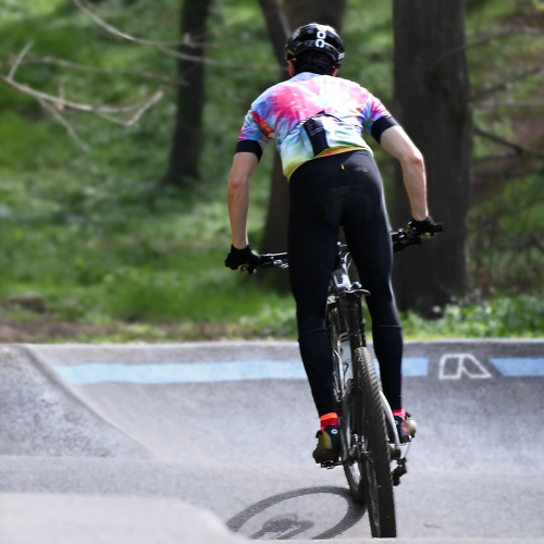 Cyclist demonstrating proper core engagement and body balance while riding road bike