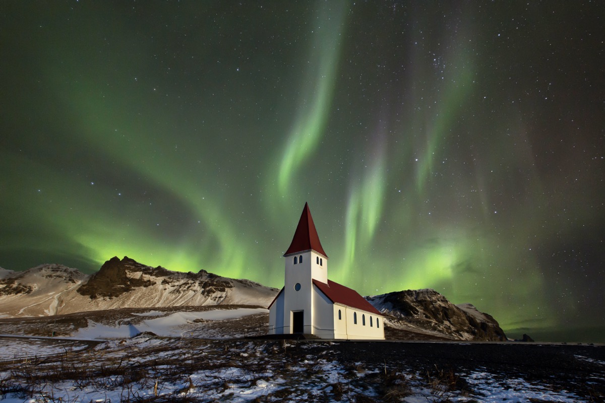The Víkurkirkja church at Vik in Iceland on a clear night