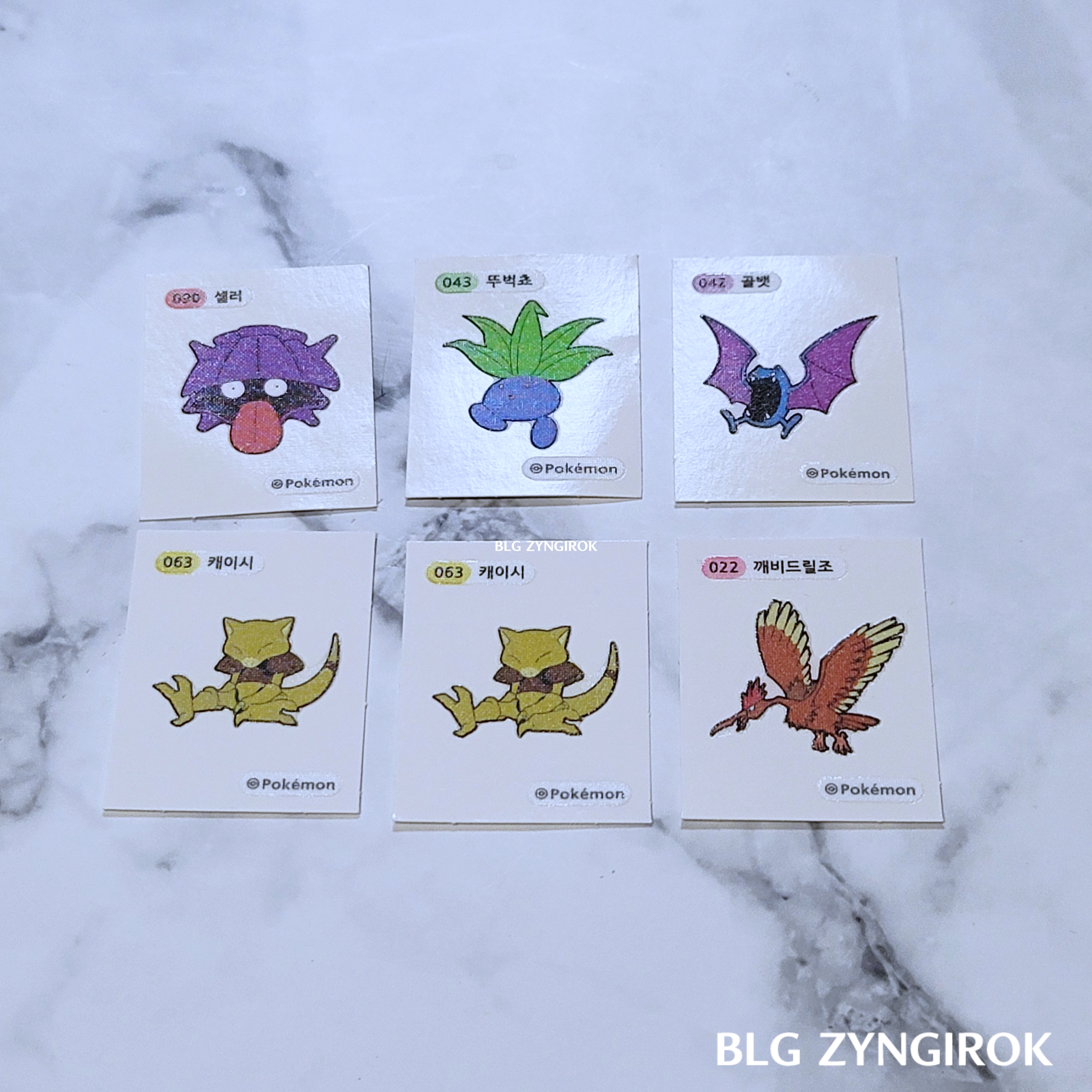 포켓몬스터-띠부띠부씰-여섯개가-놓여있다.