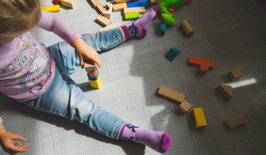 child with building blocks