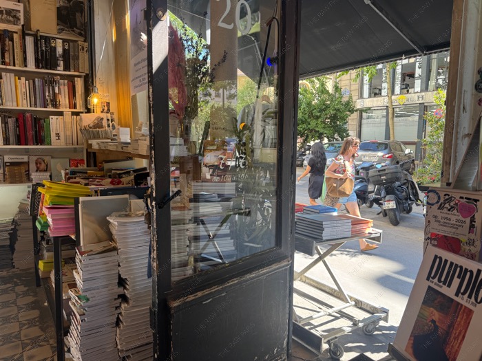 Looking out through the open glass door of Ofr Paris bookshop towards the streets of Le Marais ❘ Paris Ofr⁠