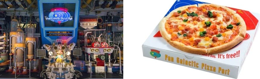 우주 공간을 연상시키는 실내에 작은 캐릭터와 우주선 모양의 모형이 있다.