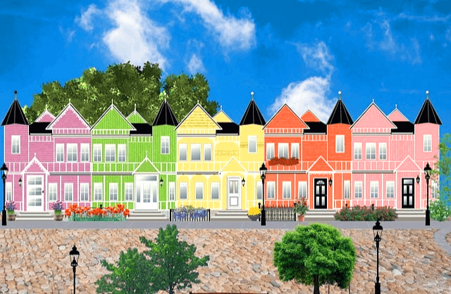 2층 주택들이 즐비하다. 분홍색, 연두색, 노란색, 주황색, 분홍색 주택들이다. 앞에는 도로가 있고 푸른 나무들도 있다.