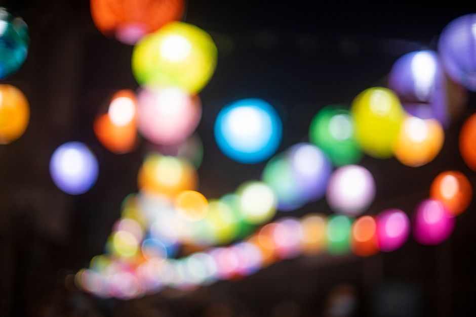 Colorful bokeh lights creating a vibrant scene in Hong Kong at night.