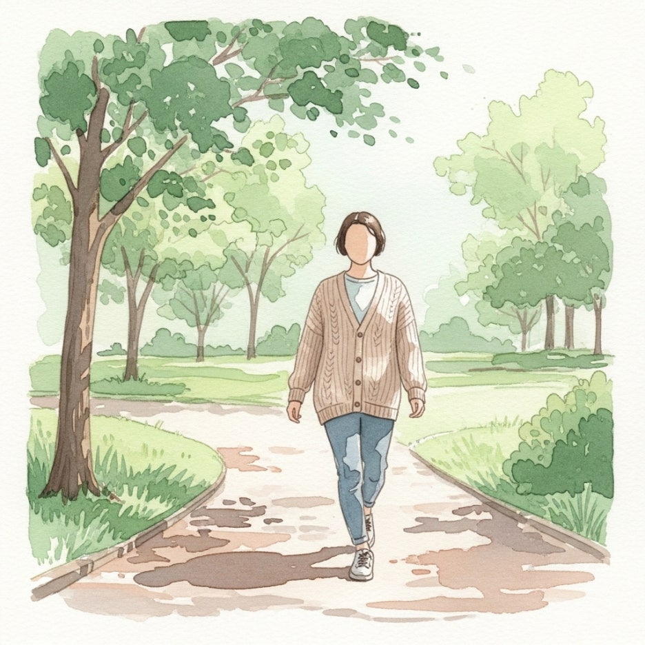 공원을 산책하며 생각에 잠긴 성인의 모습
