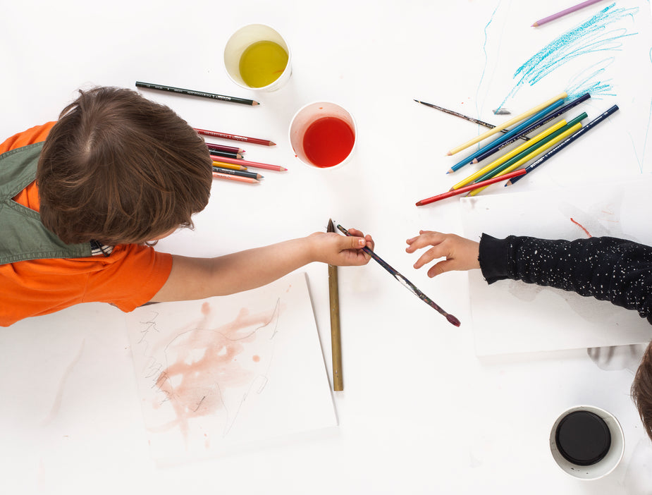children painting together