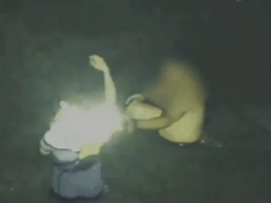 Sergeant Lee Jae-seok is helping a man in his 70s from China take off his life jacket.