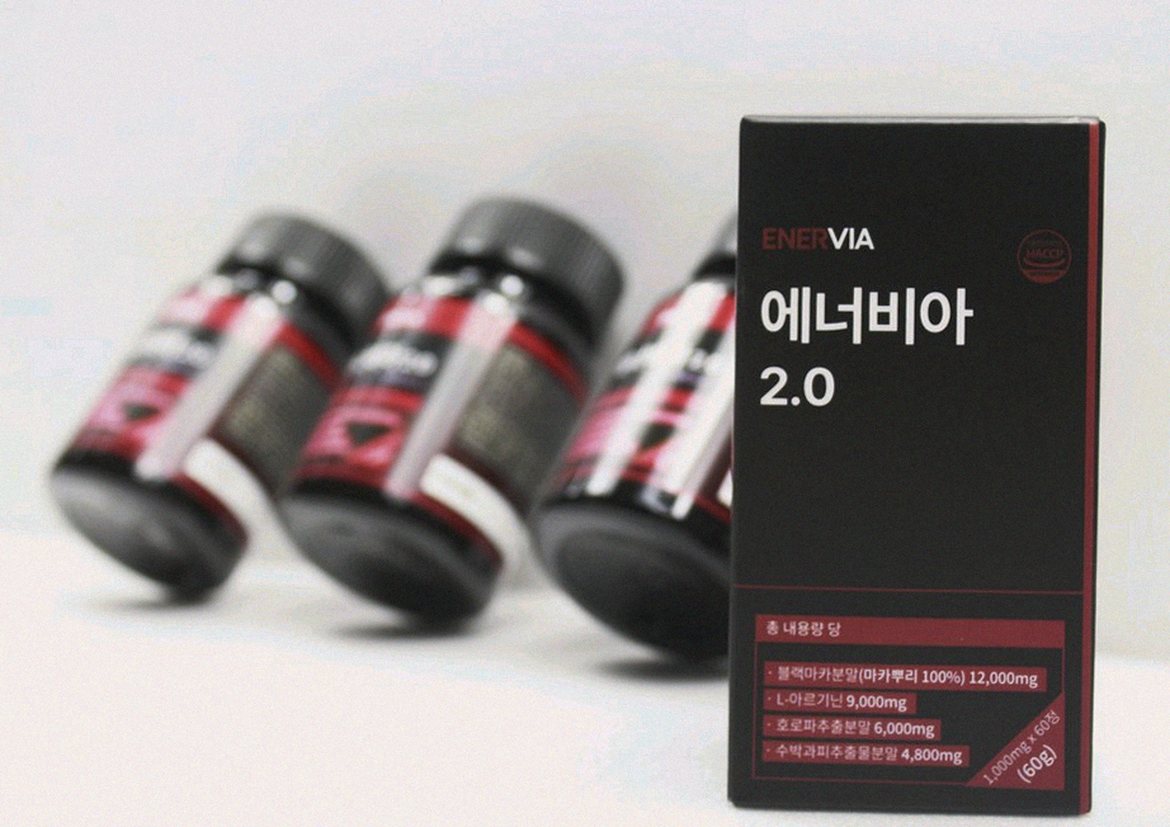 Korean Asian man holding supplement tablet