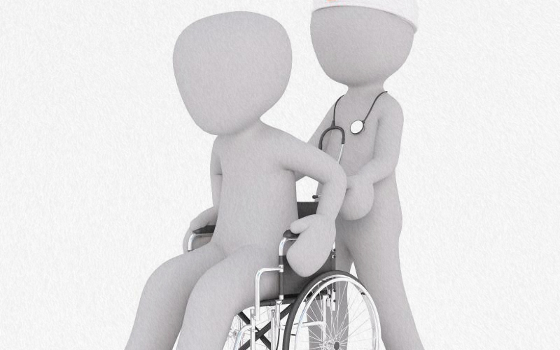 휠체어를 탄 환자와 의사