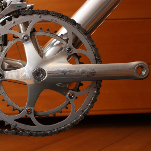 focusing on the road bike crank arm and pedal rotation structure.