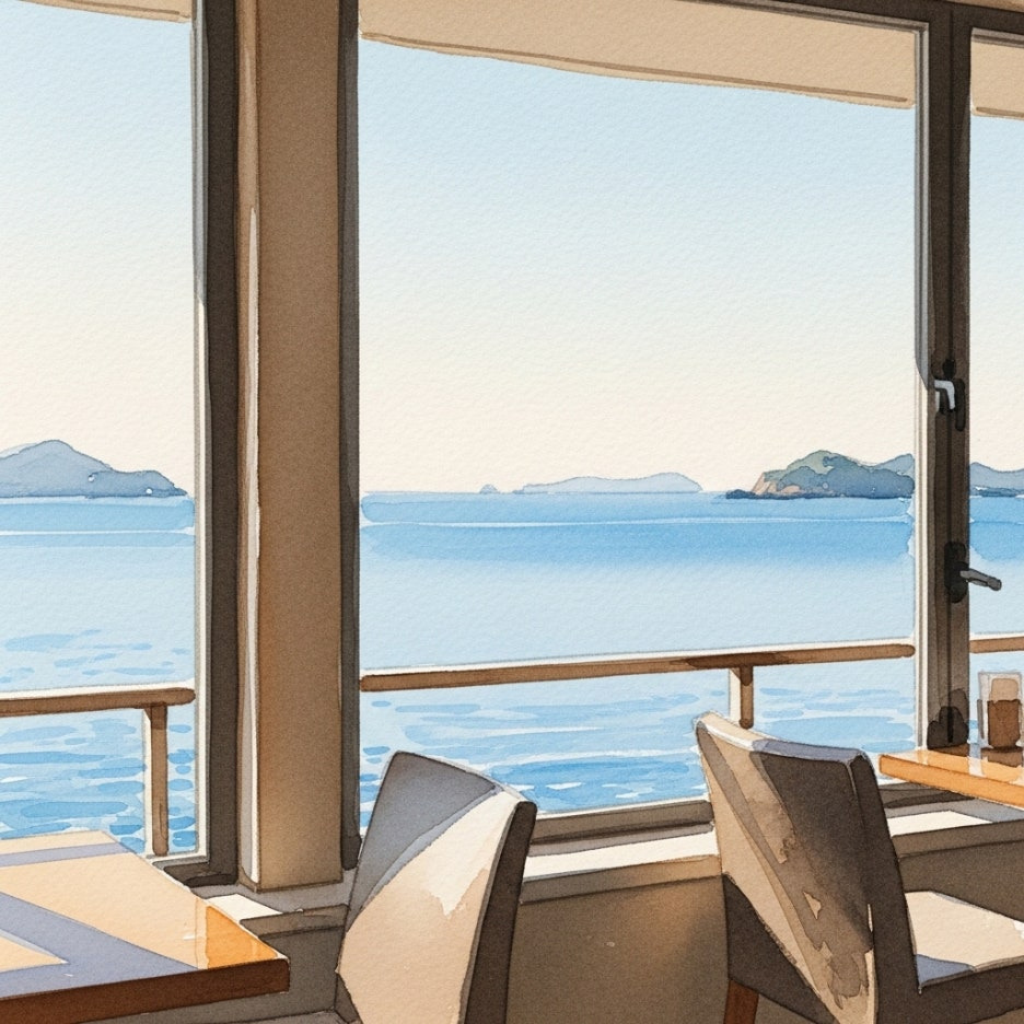 카페 내부 커다란 통창 너머로 보이는 평온한 바다 전망