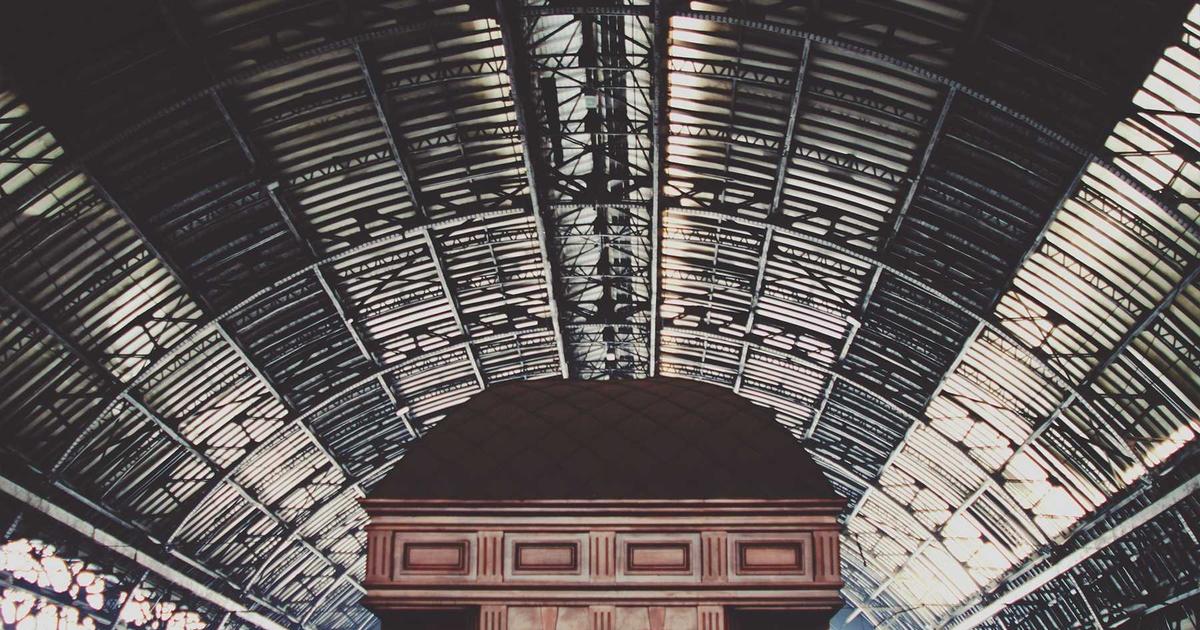 young person looking at official documents with laptop, housing benefits application