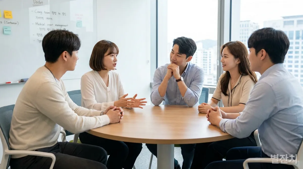 밝은 사무실에서 서로 공감하며 소통하는 한국인 젊은 직장인들