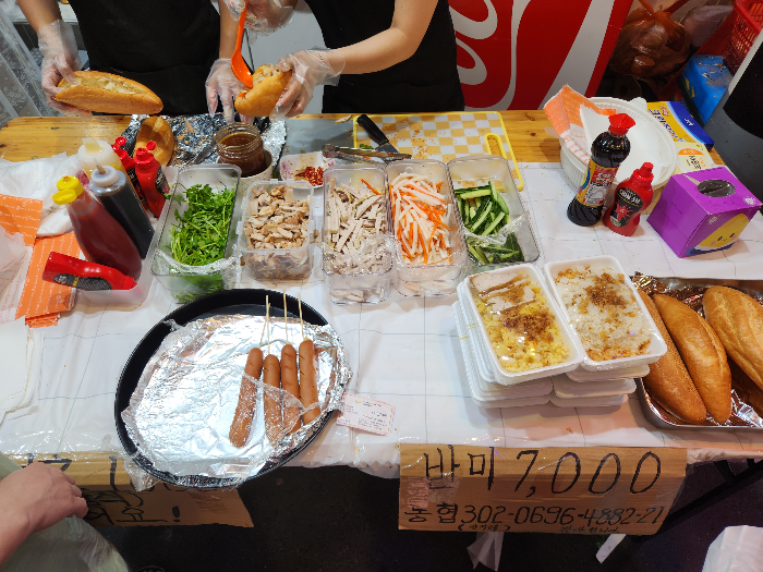 Ingredients for making banh mi sandwiches are on the table.