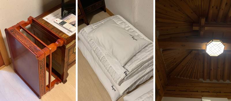 나무 테이블, 이불, 배개, 개방감 높은 천장