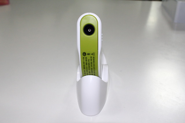 Rear view in the stand showing the infrared sensor lens and label.